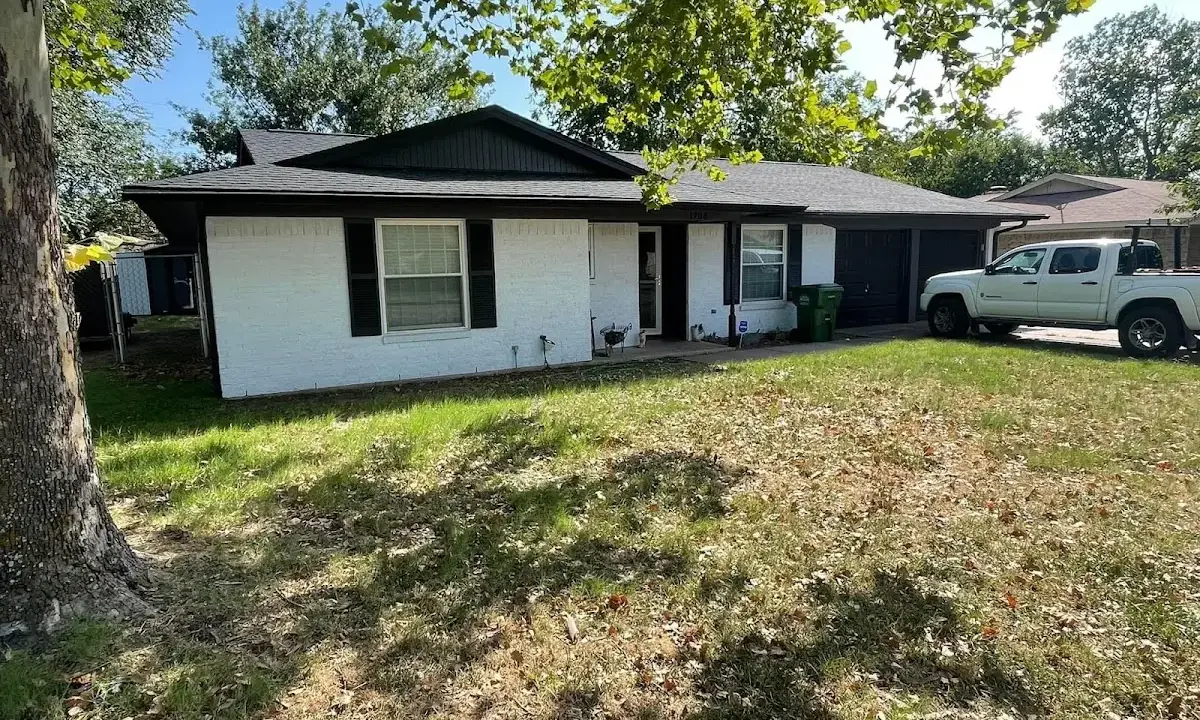 Professional roofing crew working on a residential roof in Roselle